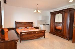 a bedroom with two beds and a dresser at Villa Marinero in Ulcinj