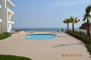 Poolen vid eller i närheten av Porto de Mos Golf & Beach B&B AL-40312