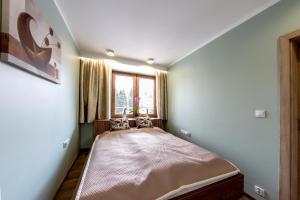 Postel nebo postele na pokoji v ubytování Apartament Eva