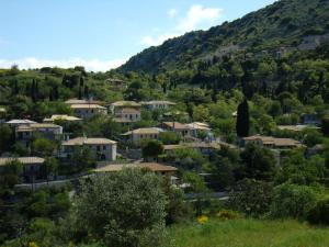 a small village in the mountains with houses at Zephyros Rooms And Apartments in Drymon