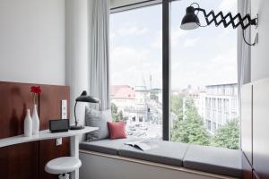 Ένα ή περισσότερα κρεβάτια σε δωμάτιο στο Ruby Lilly Hotel Munich