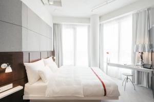 Ένα ή περισσότερα κρεβάτια σε δωμάτιο στο Ruby Lilly Hotel Munich