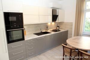 Cucina o angolo cottura di Apartments Morski Svet Portorož