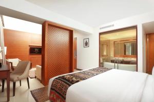 Wimarion Hotel Semarang में एक कमरे में एक या कई बेड