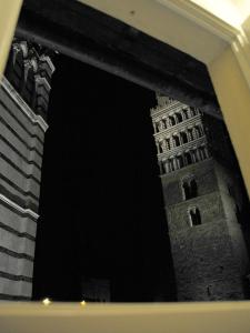 a black and white photo of a building at night at Appartamento il Battistero in Pistoia