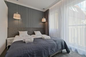 Giường trong phòng chung tại Apartamenty Gdańsk EU - Sopot Apartamenty