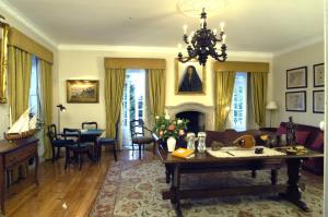 a living room with a couch and a table at Casa De Fatauncos in Vouzela