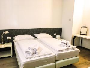 Lova arba lovos apgyvendinimo įstaigoje GardaBreak Rooms&Breakfast Holiday Apartments