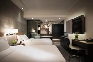 เตียงในห้องที่ Gateway Hotel, Marco Polo