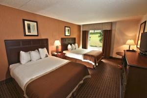 เตียงในห้องที่ Baymont by Wyndham Branson - On the Strip