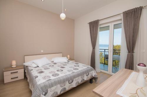 Кровать или кровати в номере Sea View Apartment Gin Brela