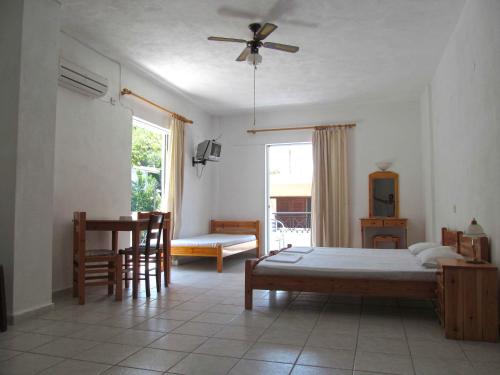 A bed or beds in a room at Pagona Hotel