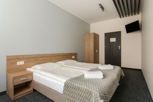 Кровать или кровати в номере Old Town Trio Hostel Rooms