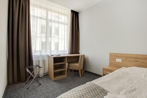 Кровать или кровати в номере Old Town Trio Hostel Rooms