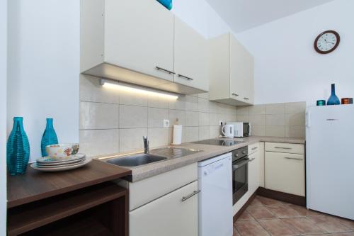 Virtuvė arba virtuvėlė apgyvendinimo įstaigoje Ecoappartment