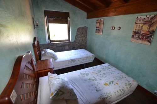 Een bed of bedden in een kamer bij La Casona del Carmen