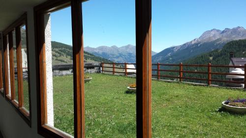 a view from a window of a mountain view at Monolocale Milky Way - Sestriere in Sestriere