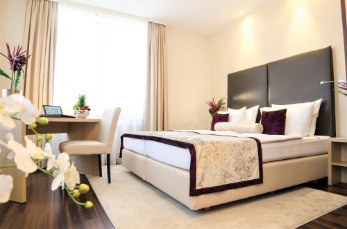 Cama ou camas em um quarto em Hotel Merkur - Superior