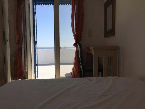 מיטה או מיטות בחדר ב-Appartement - Vue sur Mer- Hammamet