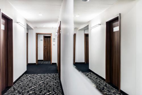 a corridor of corridors in an office building at Hotel Piano in Lublin