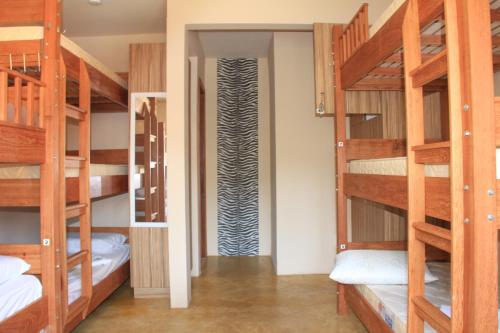 Cama ou camas em um quarto em Mama Africa Hostel