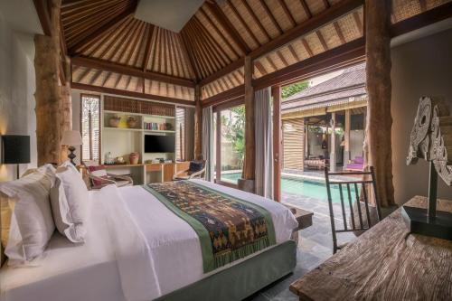 Кровать или кровати в номере The Purist Villas & Spa Ubud