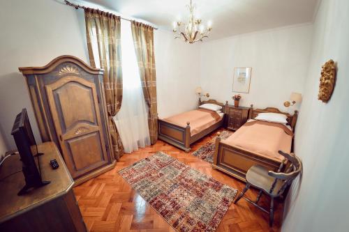 Krevet ili kreveti u jedinici u okviru objekta Antique Apartment Sibiu