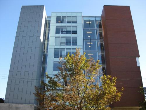 a tall glass building with a tree in front of it at University of Toronto-New College Residence-45 Willcocks Residence in Toronto