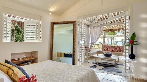 A bed or beds in a room at The Chili Beach Private Resort