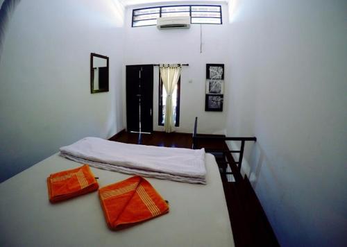 A bed or beds in a room at Tirta Yoga Inn