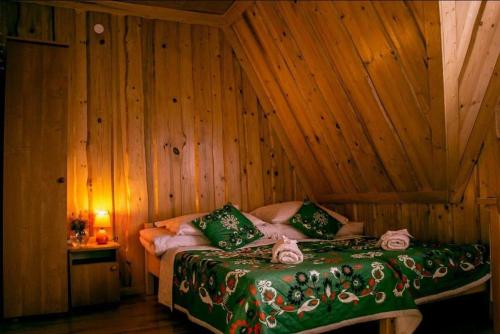 A bed or beds in a room at Agrotatry U Stachy