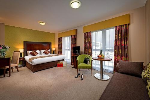 Tempat tidur dalam kamar di George Limerick Hotel