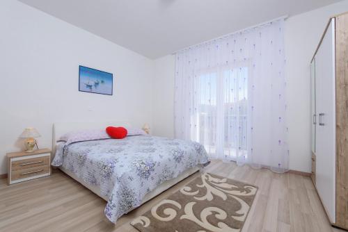 Krevet ili kreveti u jedinici u objektu Apartments & Rooms Seaside