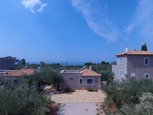 an aerial view of a brick house with trees at Kastro-Kardamili in Kardamili