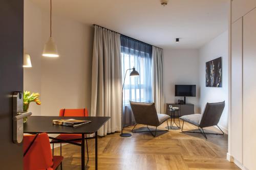 Televizorius ir (arba) pramogų centras apgyvendinimo įstaigoje SMARTments business Wien Hauptbahnhof - Serviced Apartments