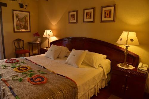 Villa Vicuña Cafayate Boutique Hotelにあるベッド