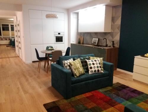 a living room with a couch and a table at Apartament Pruszków in Pruszków