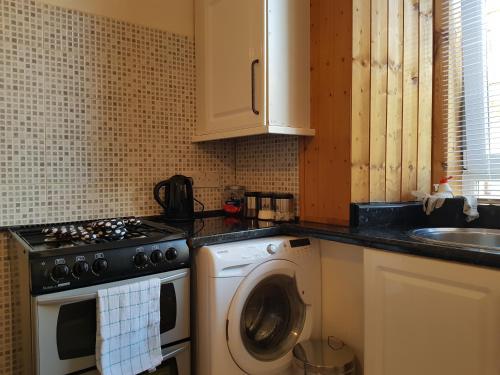 A kitchen or kitchenette at Rozina Apartment