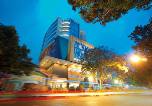 a building at night with a street in front of it at THE 1O1 Malang OJ in Malang