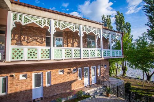 an image of a building with a balcony at Hotel Paradise Road in Kutaisi