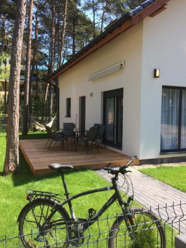 a bike parked in front of a house at The Place by Baltic sea in Łukęcin