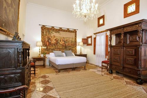 A bed or beds in a room at Casa Delmonte - Turismo de Interior