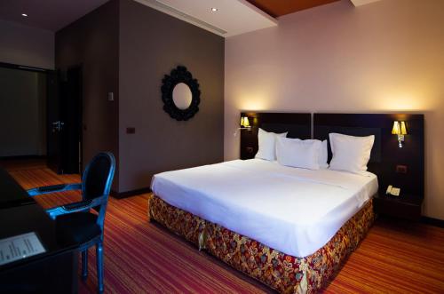 Giường trong phòng chung tại Nane Hotel