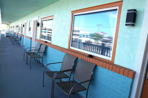 a waiting room with chairs and a window at Beachside Resort in Wildwood