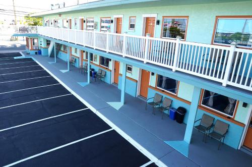 an empty parking lot in front of a building at Beachside Resort in Wildwood