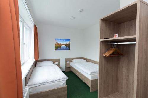 Cama ou camas em um quarto em WinBudget "bed&breakfast" Guntramsdorf