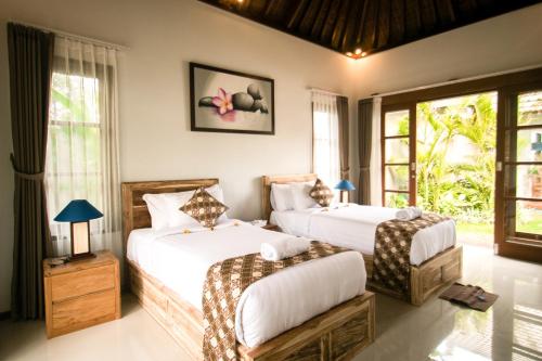 Cama ou camas em um quarto em The Secret Spot Villas