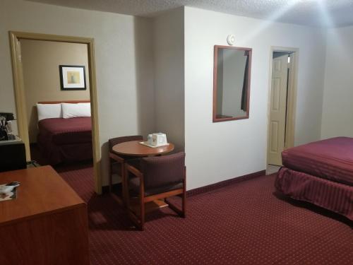 Кровать или кровати в номере Americas Best Value Inn-Williams/Grand Canyon