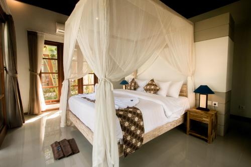 Cama ou camas em um quarto em The Secret Spot Villas