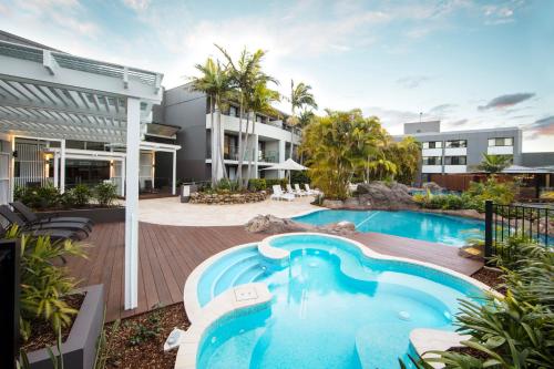 an exterior view of a house with a swimming pool at The Executive Inn, Newcastle in Newcastle